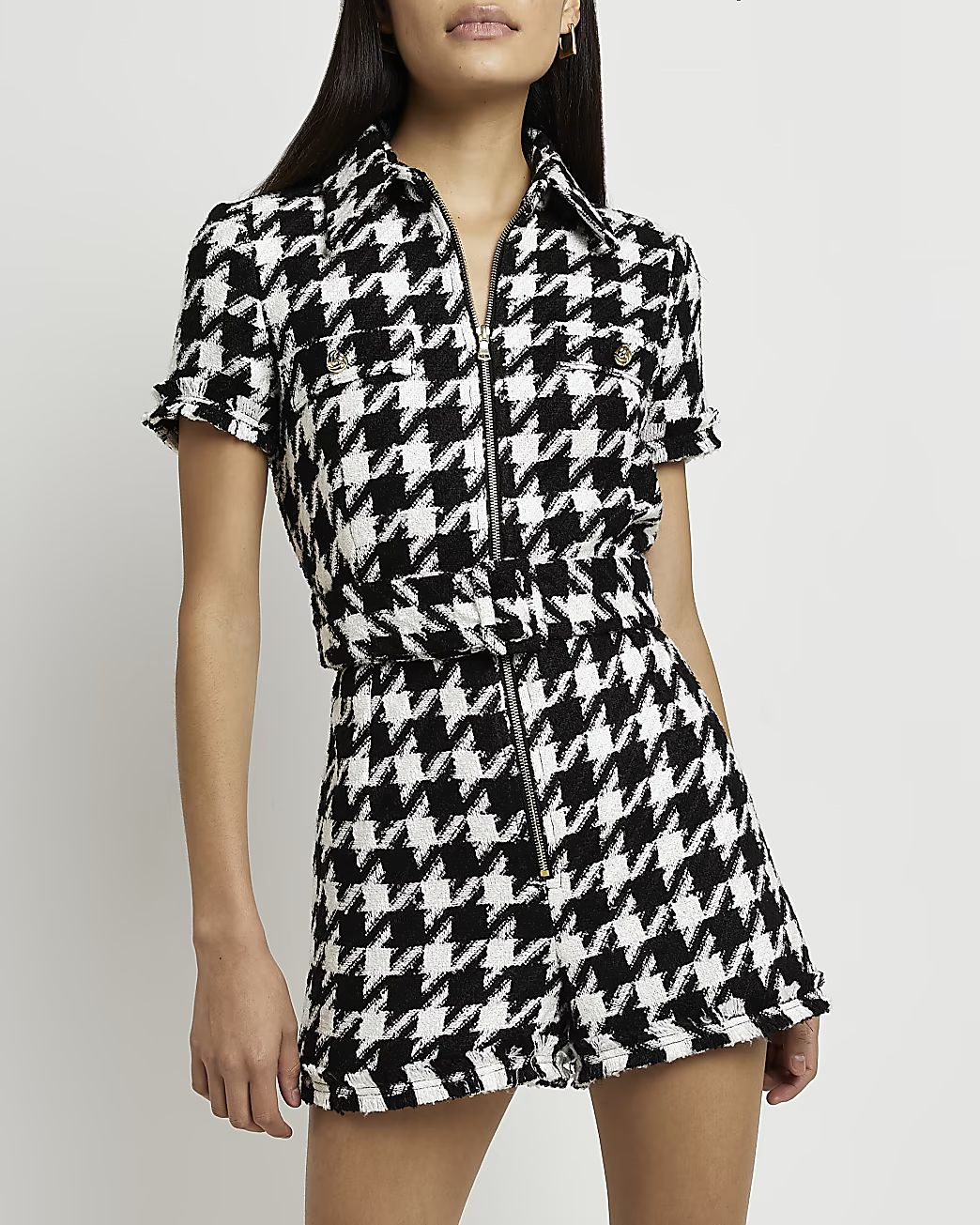 Black dogtooth boucle belted playsuit | River Island (UK & IE)
