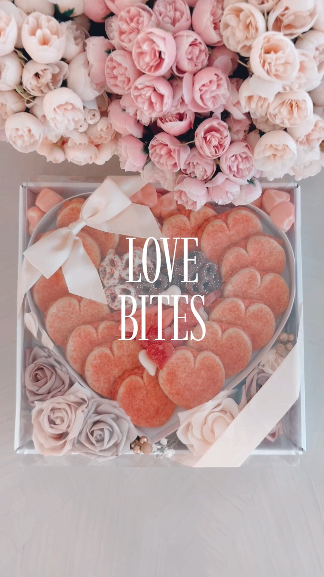 Hello, lovelies! Let's dive into some chic gifting ideas perfect for those dear to us. I stumbled upon this fabulous heart-shaped charcuterie shadow box and couldn’t wait to fill it with treats that scream sophistication. Picture this: heart-shaped sugar cookies, white and dark chocolate pretzels, and the most divine gummies in heart shapes and cherry lips – yes, they’re as delicious as they sound.
To elevate the arrangement, I added some real touch flowers in soft shades of pink and scattered marshmallows around the heart, creating an aesthetic that’s both inviting and luxe. The finishing touch? A sleek silk bow, because we all know a little elegance goes a long way. And the best part? It’s all done in under 10 minutes, making it the perfect stylish gift for any occasion or to create en masse for a gathering.
Until we meet again, keep embracing the glam in everyday moments. Stay fabulous! ❤️✨

#LTKGiftGuide #LTKSeasonal #LTKparties