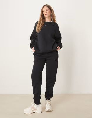Nike Phoenix oversized crew sweatshirt and mid rise joggers in black | ASOS (Global)