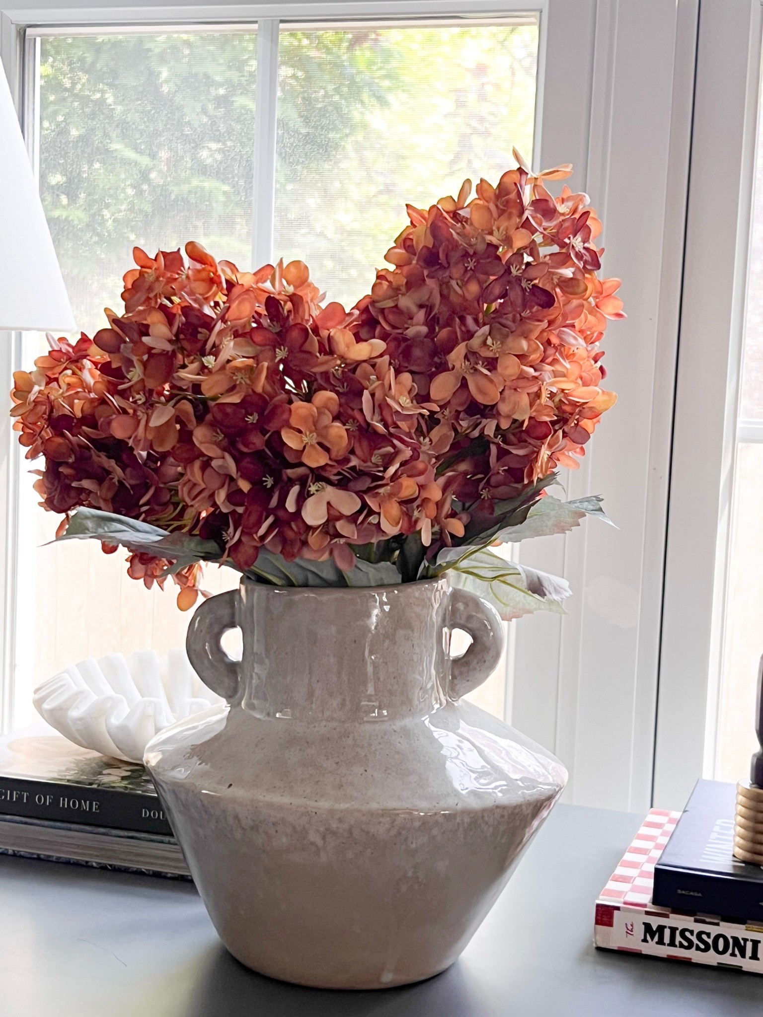 These faux autumn hydrangeas are such a beautiful way to bring fall into your home. I love the muted seasonal colors and full blooms that look gorgeous arranged in a vase. Perfect for adding a little autumn warmth to an entryway, dining table, or living room.
faux autumn hydrangeas, fall hydrangea stems, artificial hydrangeas, faux fall florals, autumn flower arrangements, fall home decor, realistic faux flowers, seasonal vase styling, fall centerpiece ideas, neutral fall decor, fall decorating ideas, girlonthehudson