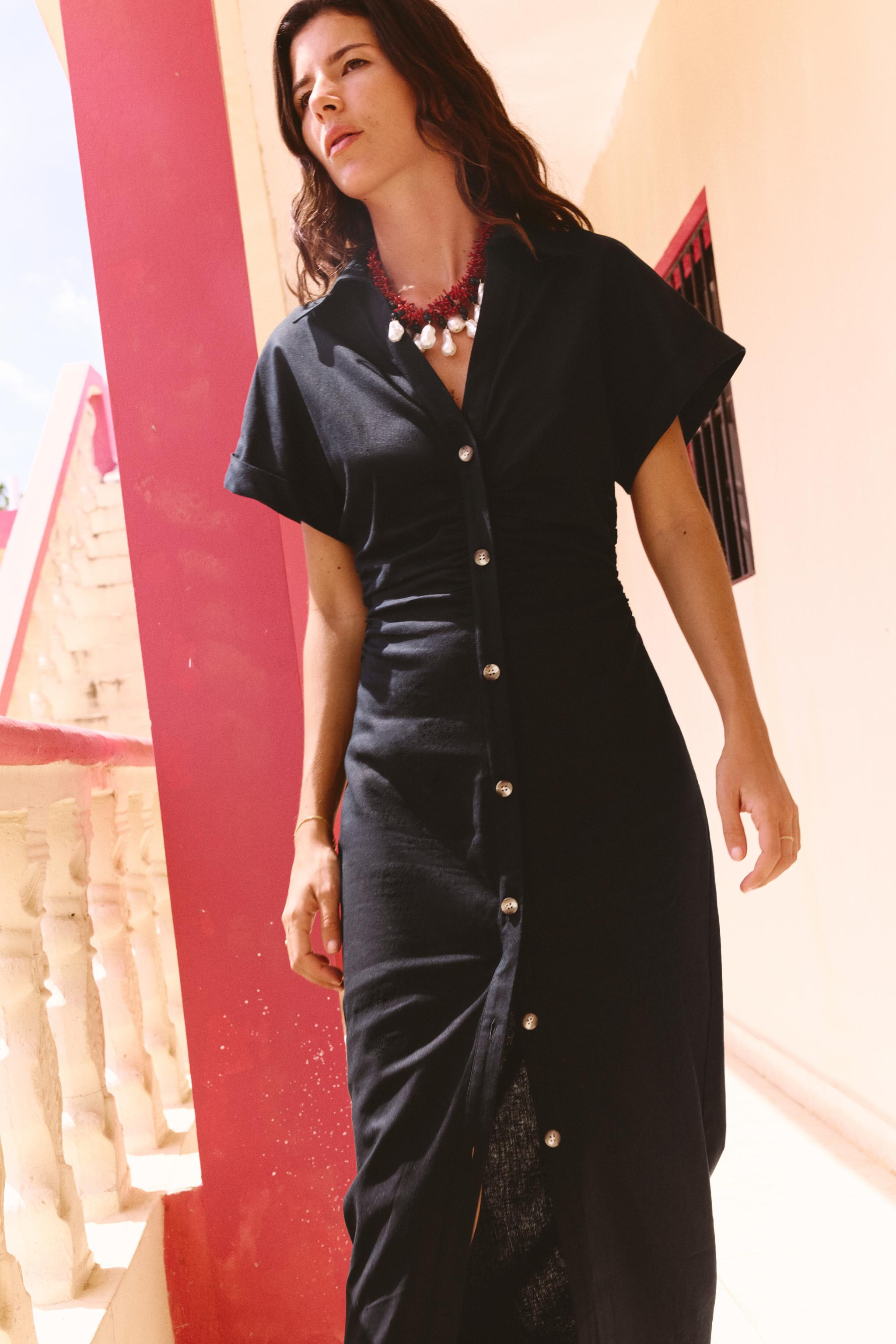 Lapel collar dress with V-neck and short turn-up sleeves. Fitted waist with gathers. Faux front b... | Zara US