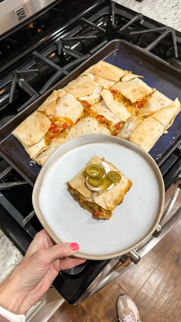 Easy Sheet Pan Crunch Wrap Supreme 🌮🔥

Craving a fun, flavorful twist on taco night? Try this super easy Crunch Wrap Supreme that’s perfect for busy weeknights—and I even used 6 tortillas for extra crunch!

Ingredients:
• 1 lb taco meat
• 1 can nacho cheese (spread evenly)
• 4 tostada shells
• 6 tortillas (for layering)
• Sour cream (dollops for each tostada)
• Shredded lettuce
• Diced tomatoes
• Shredded Mexican blend cheese
• Melted butter (for brushing and folding edges)
• Optional Toppings:jalapeños, extra sour cream, avocado

Instructions:

1️⃣ Cook Taco Meat: Brown 1 lb of ground beef with your favorite taco seasoning. (I cooked extra for lunches!)
2️⃣ Layer Base: On a sheet pan, lay 3 tortillas side-by-side as the base. Spread one entire can of nacho cheese evenly over them.
3️⃣ Add Filling: Spoon a layer of taco meat on top of the cheese.
4️⃣ Build Tostada Layer: Arrange 4 tostada shells over the meat and add a dollop of sour cream on each.
5️⃣ Top It Off: Add shredded lettuce, diced tomatoes, and a generous sprinkle of shredded cheese.
6️⃣ Final Wrap: Cover with the remaining 3 tortillas. Brush the edges with melted butter and fold them in to seal the wrap.
7️⃣ Bake: Pop the sheet pan in a preheated 350°F oven for 40 minutes. Remove the top layer and bake for an extra 5 minutes to crisp up those tortillas.
8️⃣ Serve: Cut into pieces with a pizza cutter and add any extra toppings you love.

Enjoy this crunchy, cheesy, and delicious meal that’s perfect for sharing. Save this recipe and tag me if you try it!

#CrunchWrapSupreme #SheetPanMeal #EasyDinnerRecipes #TacoNight #MexicanInspired #OnePanMeal #ComfortFood #QuickDinner #FamilyMeal #ViralRecipe #FoodieFavorites #DinnerInspo