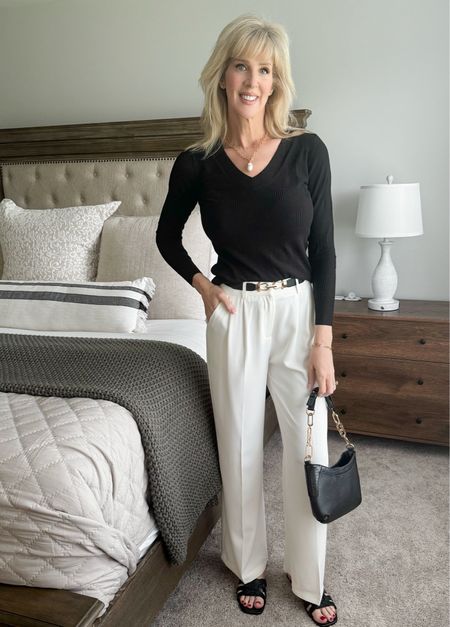 The comfiest trouser pants and a lightweight sweater make for a perfect workday outfit, a luncheon or a night out.  

Wearing a Tall Small in trousers, Small in sweater.   

Handbag is out of stock but I’ve tagged similar ones.  If you want to know when this one is back in stock, heart the handbag and you’ll be notified when it’s back.  

#LTKWorkwear #LTKFindsUnder50 #LTKOver40