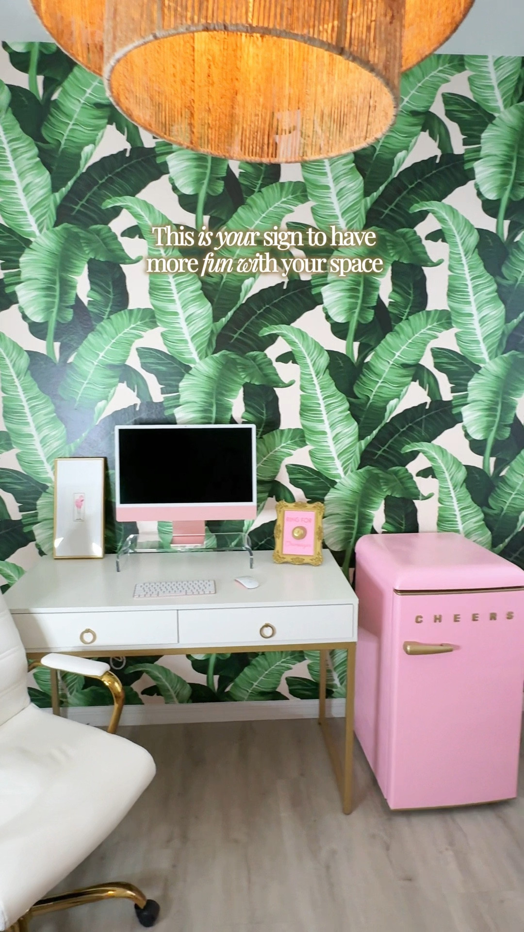 Palm beach office vibes. Banana leaf wallpaper, pink sofa, round gold bar cart 



#LTKHome