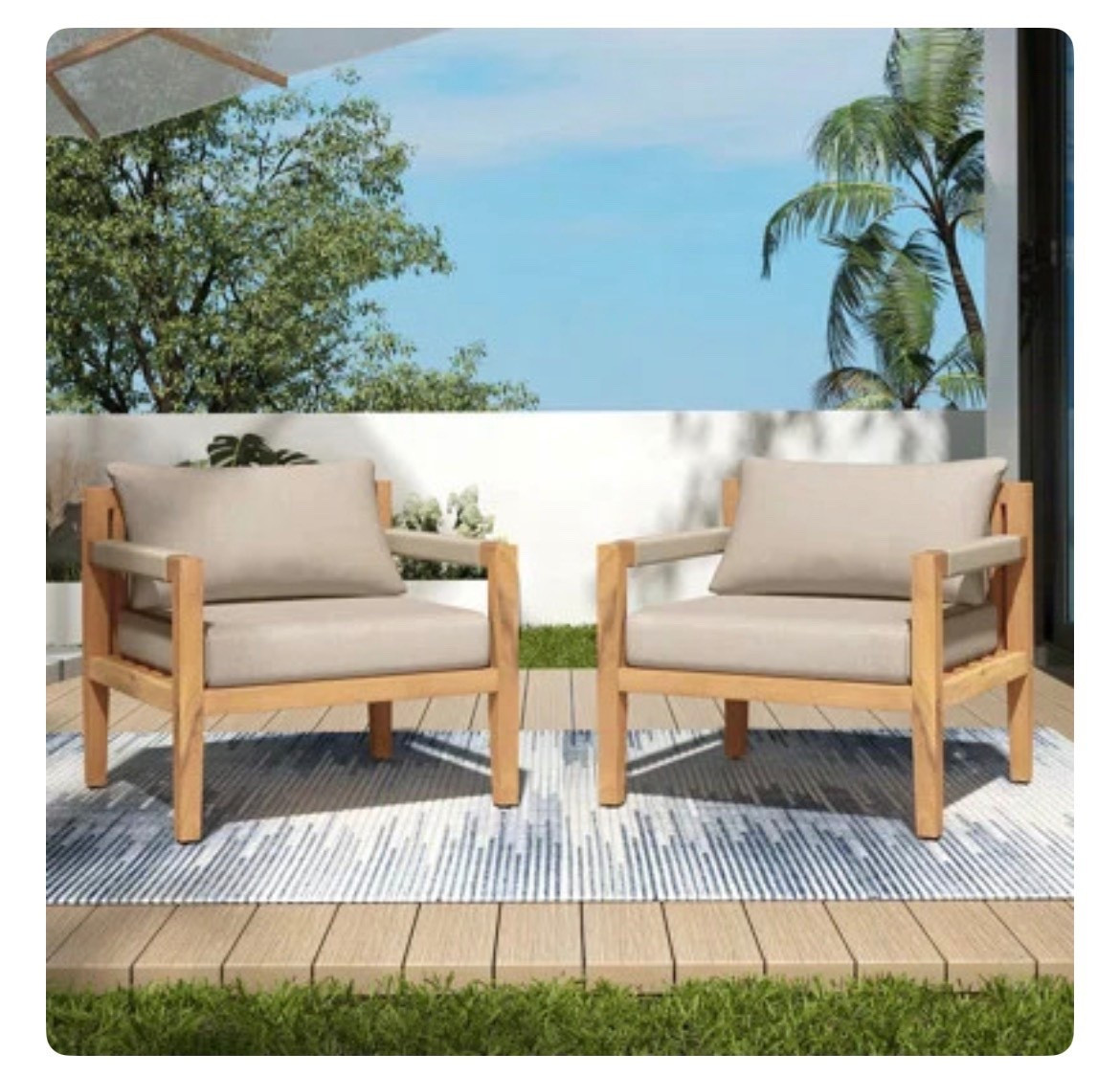 These wooden outdoor lounge chairs are the perfect blend of modern and relaxed. The natural wood frame paired with plush neutral cushions creates a clean, elevated look that feels both cozy and resort-inspired. Styled on a patio with an outdoor rug, greenery, and warm wood decking for an easy, laid-back setup that’s perfect for morning coffee or evening lounging. 
