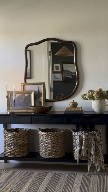 Entryway inspiration, console table styling, home decor, transitional style, organic modern, black console table, paper mache bowl, brass candlesticks, large wicker basket, vintage throw, rattan conical lamp shade, antique inspired large mirror, minka pot, modern mirror, large mirror, Loloi rug, transitional design, low pile rug, wall art, collected look
 

#LTKVideo #LTKsalealert #LTKhome