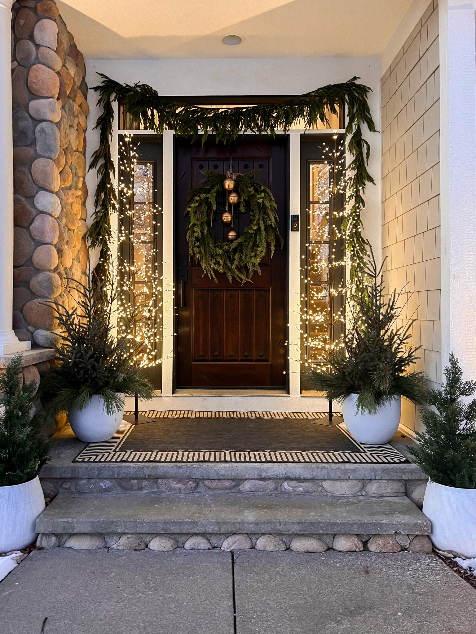 Holiday front door decor, outdoor rug from rugs USA, twinkle trees, pottery barn, look for less, holiday dupes, holiday wreath, Norfolk wreath, white pots, faux cypress shrubs 

#LTKstyletip #LTKhome #LTKHoliday