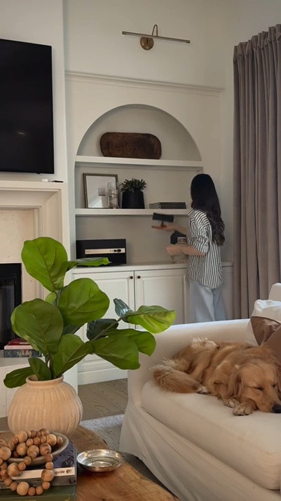 My favorite shelf styling always leaves blank spaces where the eye can rest and clutter can be dropped without making a room feel too busy or messy. 

Comment SHOP for everything linkable- including the dough bowl and sweet stool that is a family favorite.
