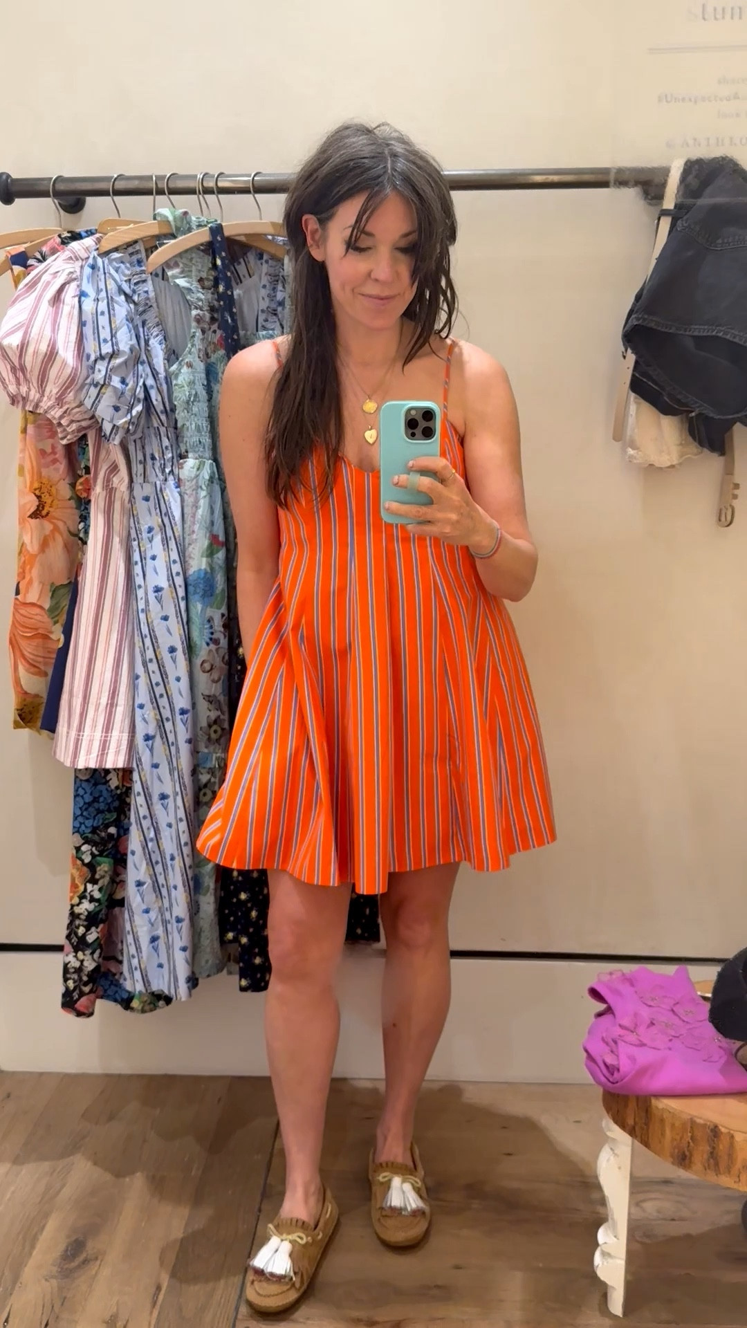 I love this bright and colorful dress! It’s just right for beach trips and pool parties. The pop of orange is so fun. I’m wearing a medium, and it’s just right.

#LTKmomlife #LTKOver40 #LTKSeasonal