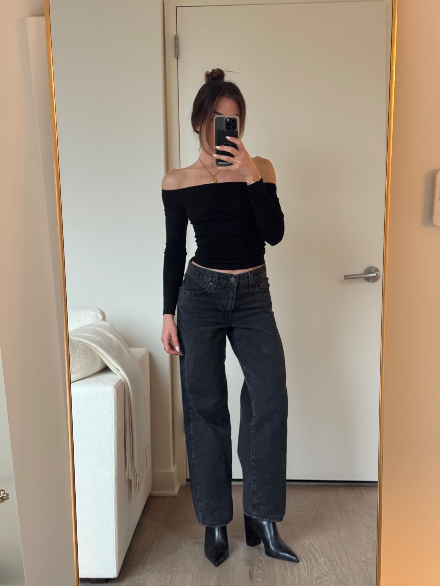 Off the shoulder black top, baggy Levi black denim, black pointed toe ankle boot

#LTKSeasonal #LTKHoliday #LTKootd