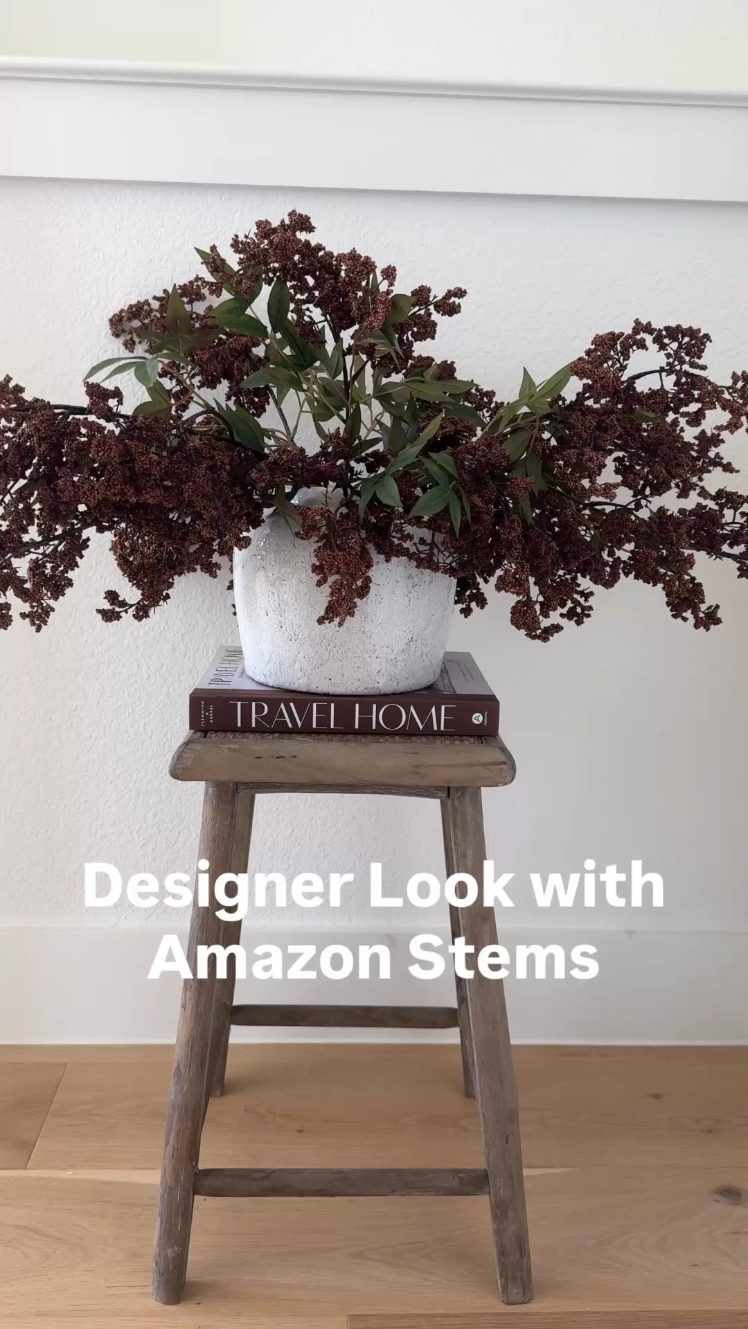 A simple little corner styling moment that instantly makes a space feel finished 🤎 I styled this rustic stool with my favorite Amazon berry stems and a textured Magnolia vase for an easy designer-inspired home decor look. Oversized stems are one of my favorite affordable styling tricks because they instantly add fullness and texture without needing a large arrangement. The rustic stool is from Wayfair and works beautifully as a small side table, plant stand, or accent piece in neutral spaces. The white Magnolia vase is currently on a great sale, so I linked it along with the Amazon berry stems and the Wayfair stool if you want to recreate this simple styling moment. Save this for neutral home decor inspiration later. Follow me on LTK for daily fashion, home decor & Amazon finds.

#LTKSaleAlert #LTKvlog #LTKHome