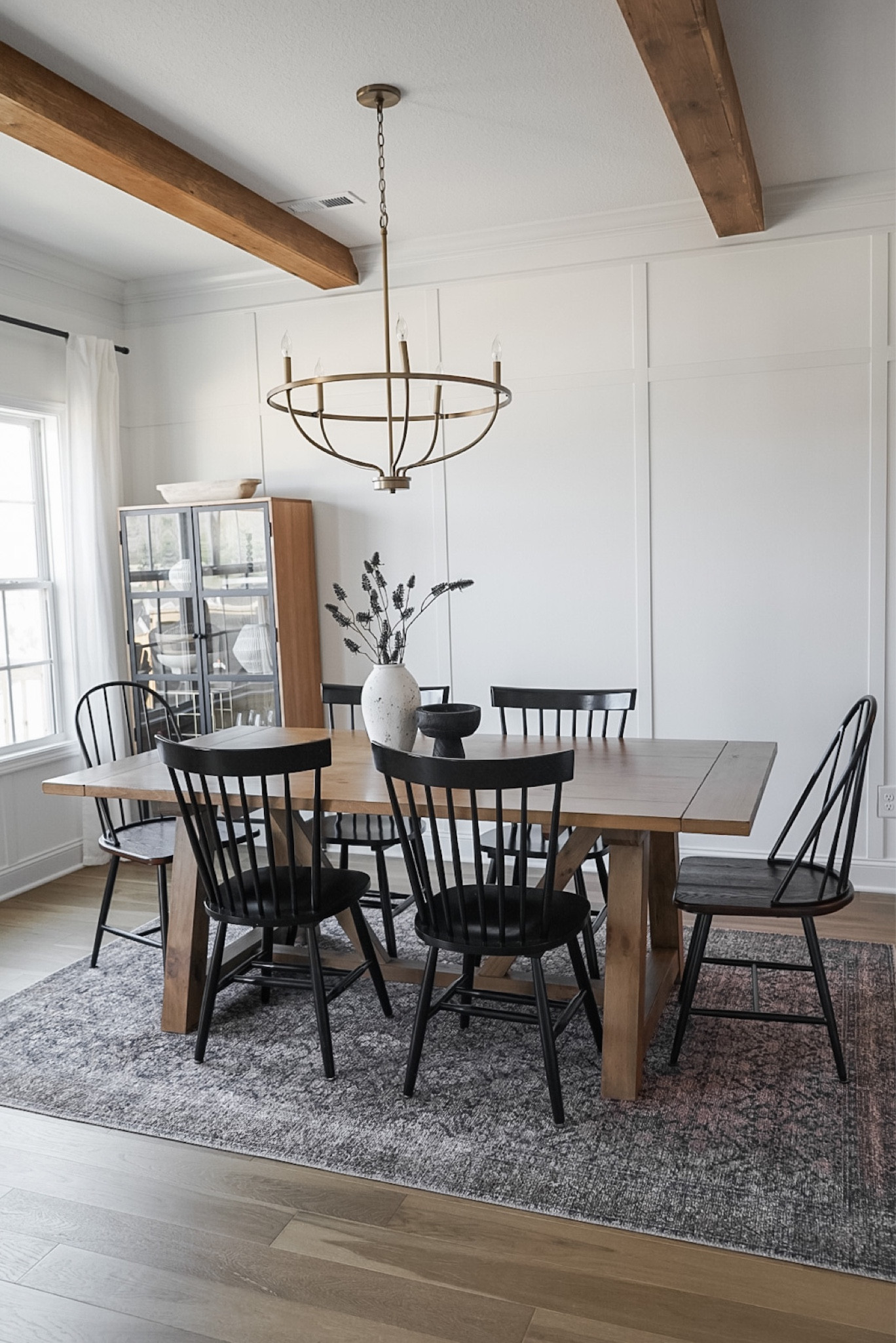 Dining room table, brown table black chairs, dining room rug, loloi rug, minimal modern dining room, gold chandelier, dining room cabinet, world market furniture 

#LTKhome