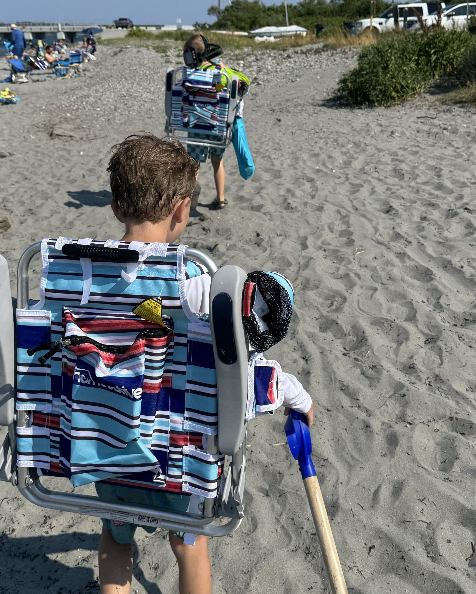 Beach days are so much easier when they can help carry things! Best mom purchase yet - kids beach chair that carry like a back pack! 🤪👏🌊⛱️
