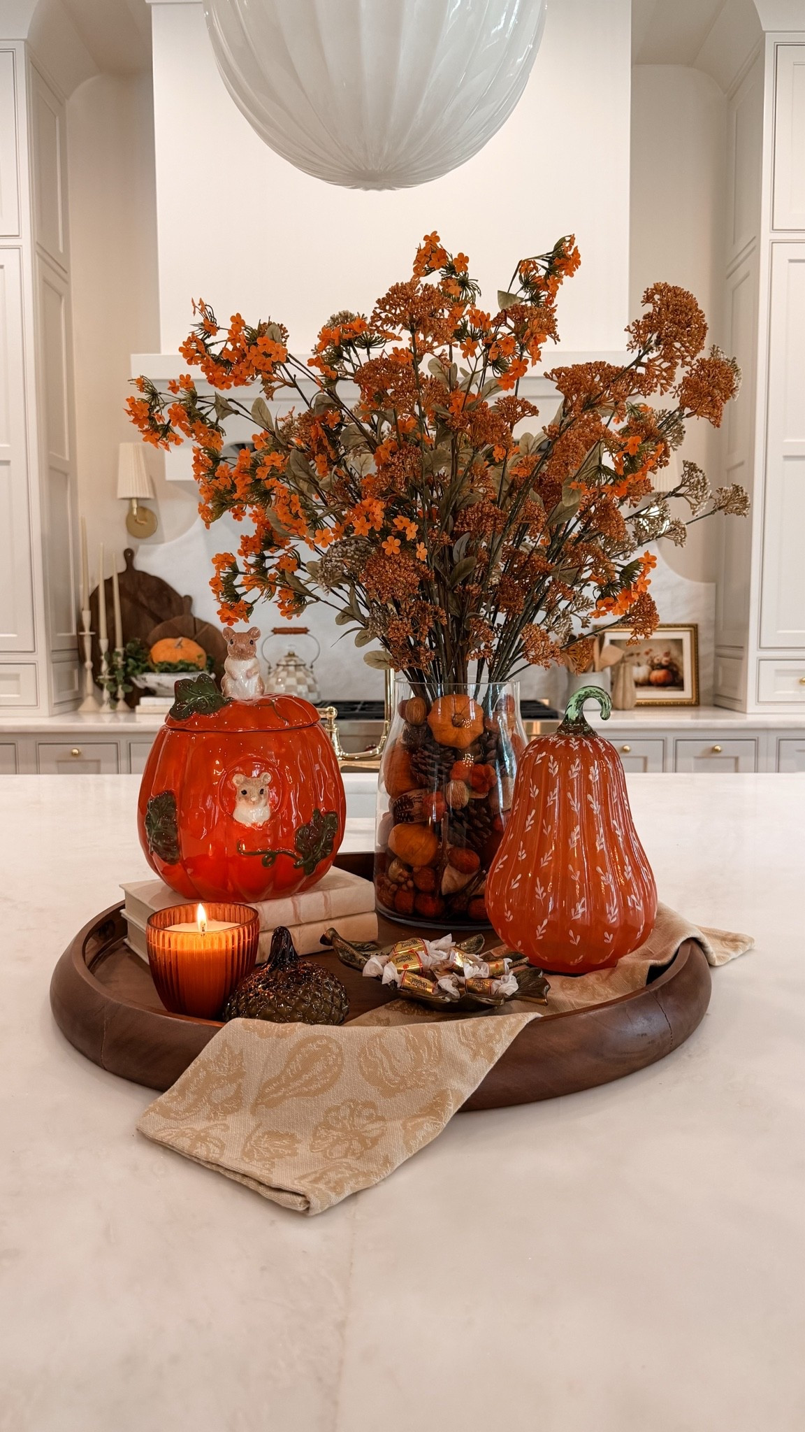 If cozy, collected fall décor is your style, this centerpiece is one of my favorite ways to decorate a kitchen island for the season. 🤎 World Market has the most beautiful Fall pieces out right now that make decorating so easy! Layering warm amber glass, textured pumpkins, faux fall florals, wood tones, and cozy candlelight creates a timeless look that feels elevated without being overdone. Everything is linked from World Market to help you recreate this cozy autumn centerpiece in your own home! #WorldMarketFinds @WorldMarket #WorldMarketPartner

#LTKSeasonal #LTKHome