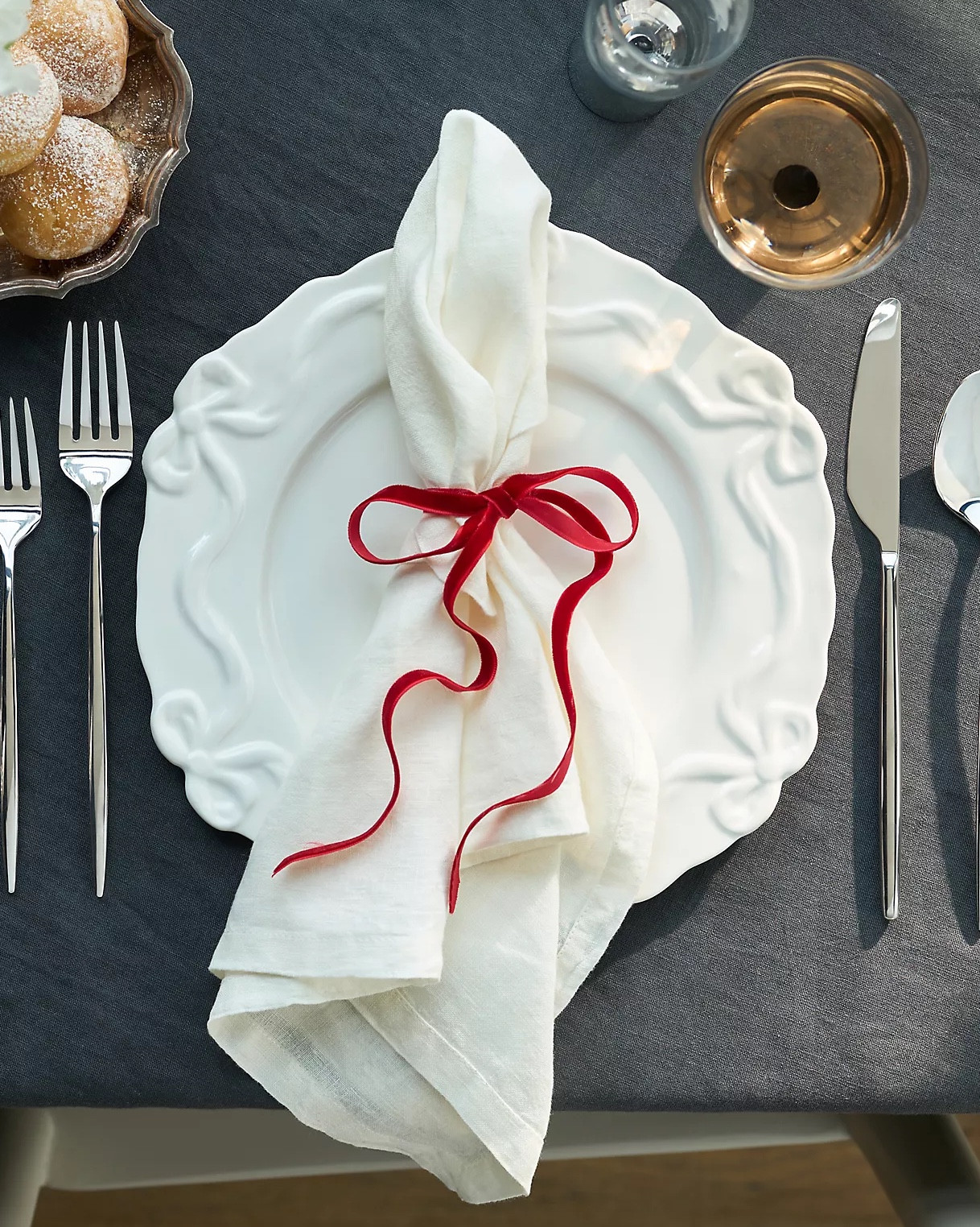 Celebrate the art of hosting with the Benedita Collection, where every meal feels like a special occasion. This set of four dinner plates, crafted from durable glazed stoneware, features delicate hand-painted bow embellishments that add a festive, gift-like charm to your table. Perfect for making every gathering unforgettable.

#LTKSeasonal #LTKHoliday #LTKHome