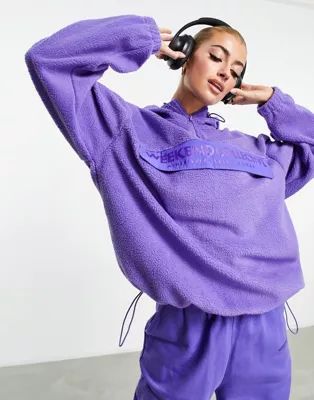 ASOS Weekend Collective half zip hoodie fleece with nylon pocket in purple | ASOS (Global)