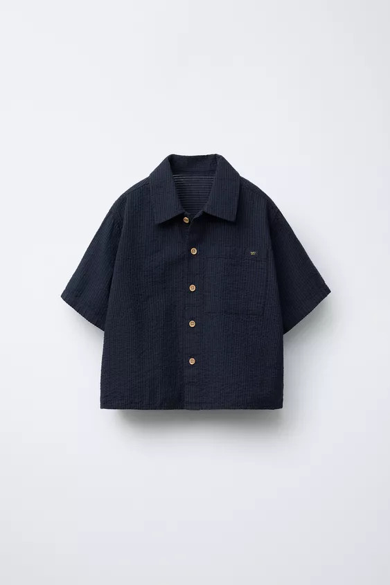 Shirt with collared neckline and short sleeves. Front button closure. Patch pocket on chest. | Zara US