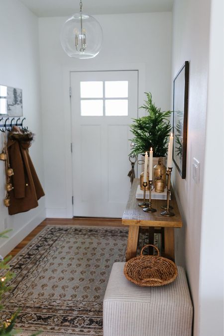 A simple holiday entryway with a Target Studio McGee wool area rug, affordable farmhouse console table, flameless candles and a tabletop tree  

#LTKsalealert #LTKhome #LTKHoliday