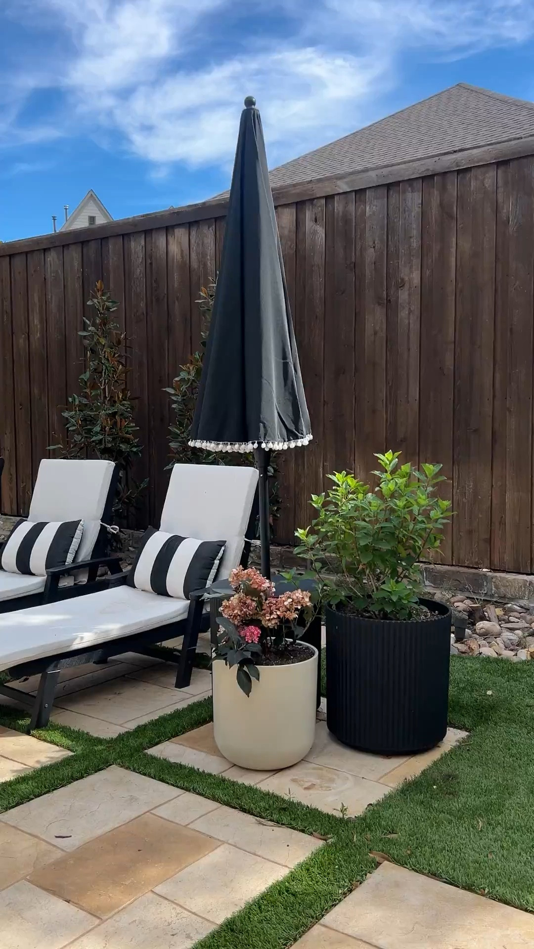 Backyard refresh with a clean, modern patio setup. Neutral lounge chairs, black and white accents, outdoor planters, and stone pavers create such an elevated but cozy space for spring and summer.

#LTKSeasonal #LTKHome