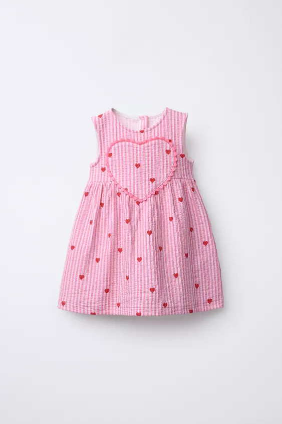 Round neck sleeveless dress. Featuring a buttoned teardrop opening at the back, a striped print a... | Zara UK