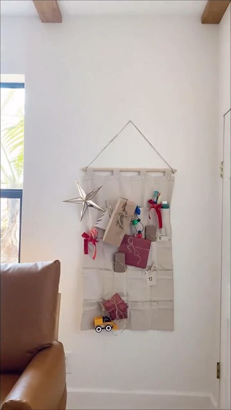 We love a good IKEA Hack and what's better than a Easy DIY IKEA Nereby Hack Advent Calendar and Advent Calendar Ideas? We made this IKEA HACK DIY Advent Calendar for $28. Using the IKEA Nereby Hanging Organizer, birch dowel, twine, and a little sewing magic we made this 2’x3.5’ DIY Reusable Advent Calendar!

#LTKSeasonal #LTKfindsunder50 #LTKHoliday