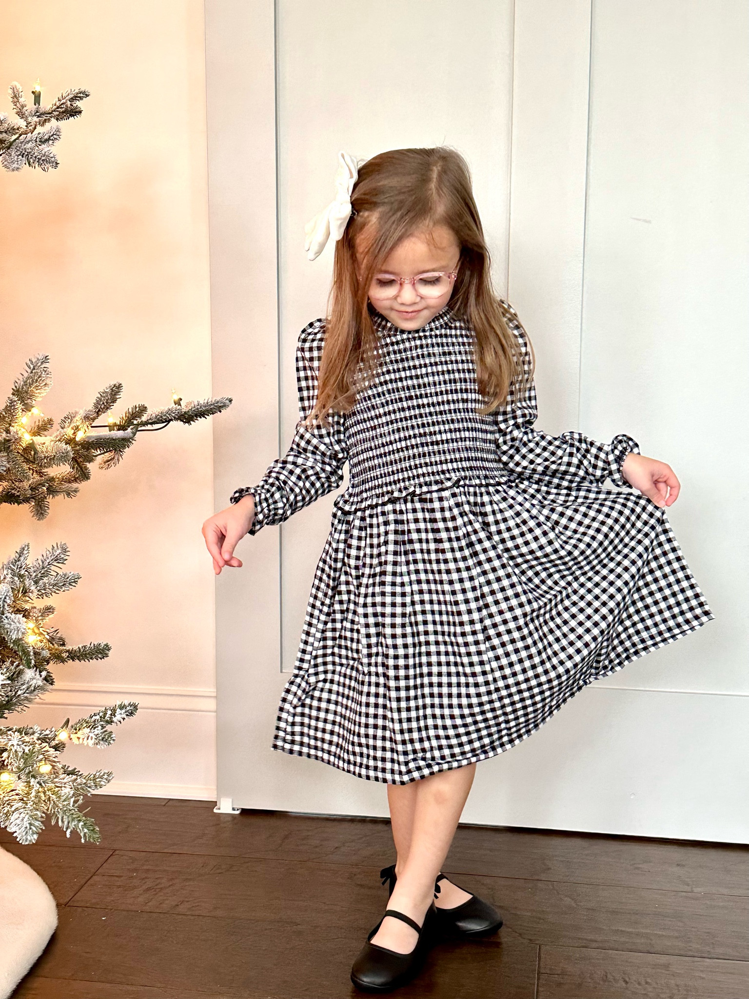 How cute is this black and white gingham dress from @walmartfashion? #walmartpartner 
This 100% cotton smocked dress is perfect for family photos, a holiday party or a day at school. My favorite part is the sleeve detail and the ruffle trim! I paired it with a pair of black ballet flats that Cora said were very comfy.  You can get this whole look for under $26! 
#walmartfashion 

#LTKfamily #LTKHoliday #LTKSeasonal