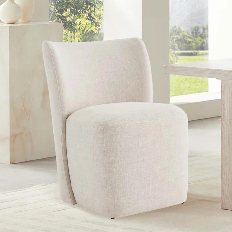 Madie Upholstered Dining Chair with Casters | Wayfair North America
