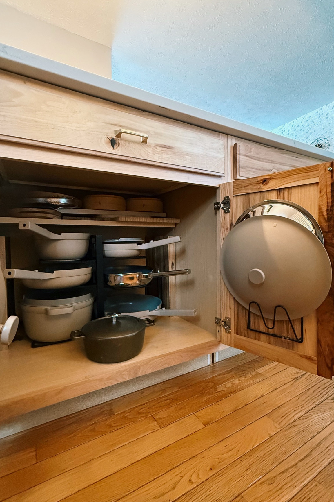 My favorite #OurPlace pans all organized and easily accessible in the kitchen cabinet with these lid organizers and rack! #ourplacepartner 

#LTKHome #LTKFindsUnder100