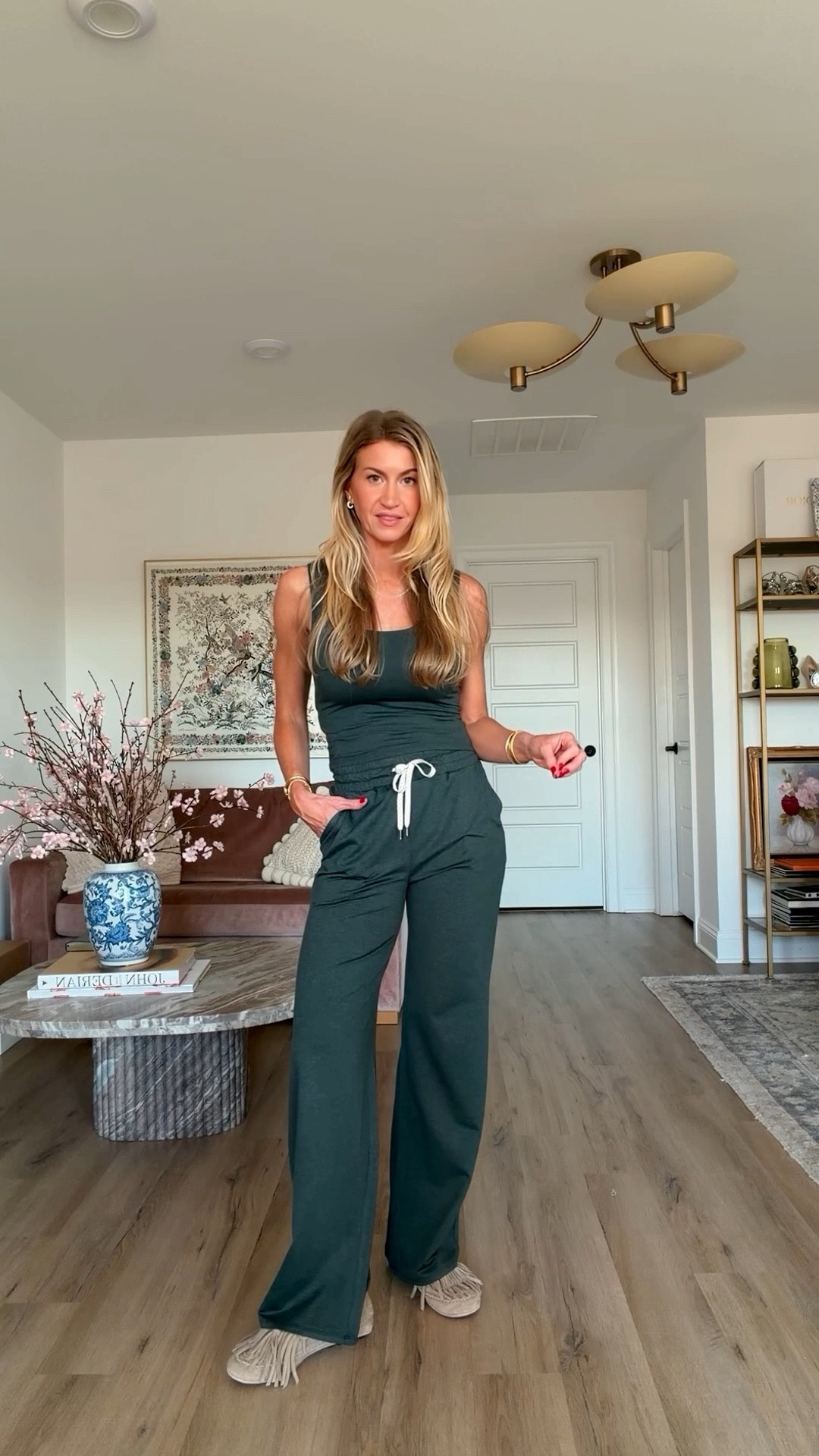 I have absolutely become a @Vuori US  super fan! They just released some of my favorite pieces in this new colorway Hemlock, this luxe hunter green and I am obsessed.  #VuoriPartner

Halo Essential Wideleg Pant runs TTS, wearing a S, reg length
Halo Essential Scoop Tank runs TTS, wearing an XS
Halo Modern Crew runs TTS, I am wearing a L for the oversized fit

#LTKactivewear #LTKstyle #LTKmovement