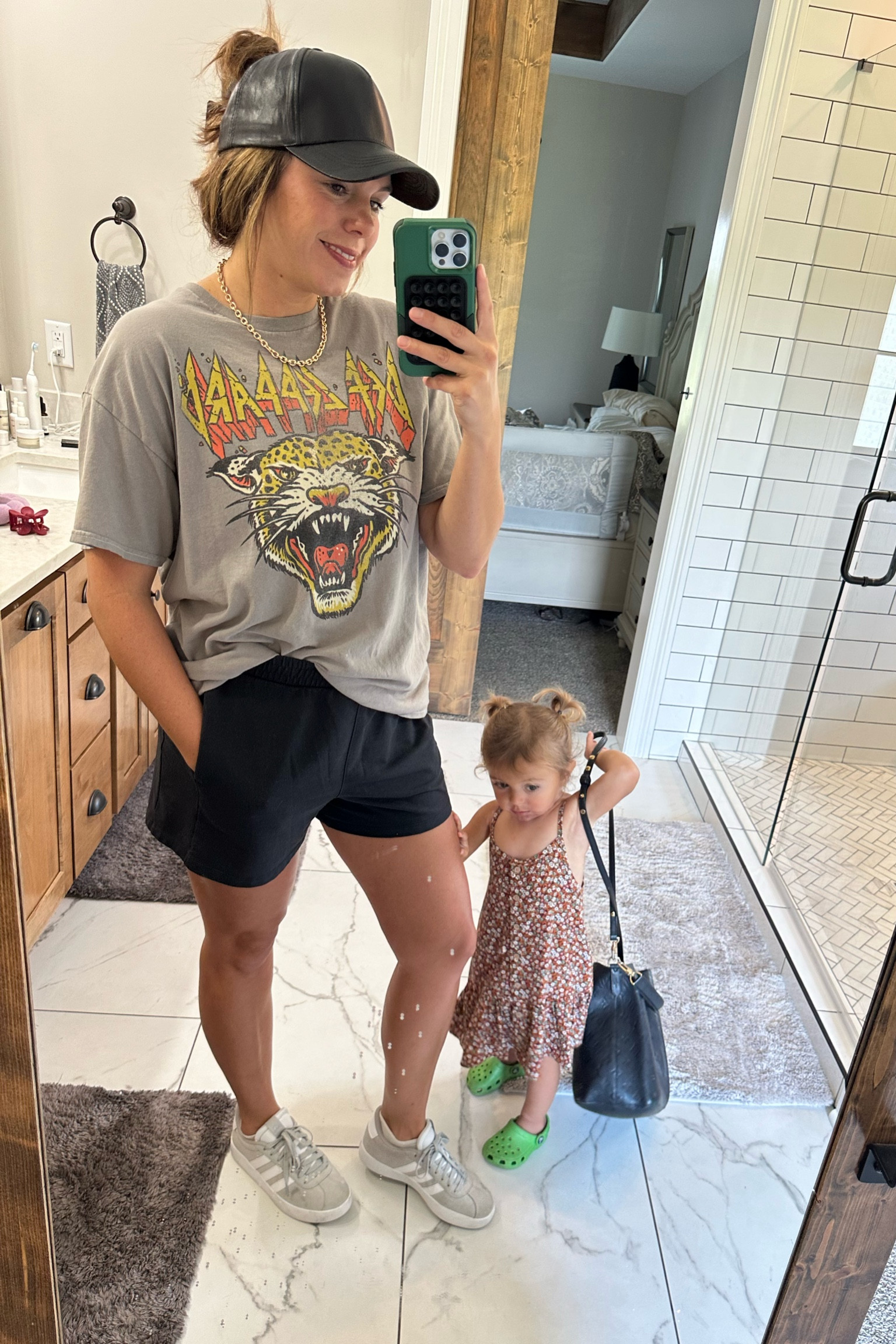 Mom fit of the day. Cozy transition piece for running errands. Graphic tee and shorts. Hat day. Claw clip. Adidas shoes. Midsize

#LTKShoeCrush #LTKFamily #LTKMidsize