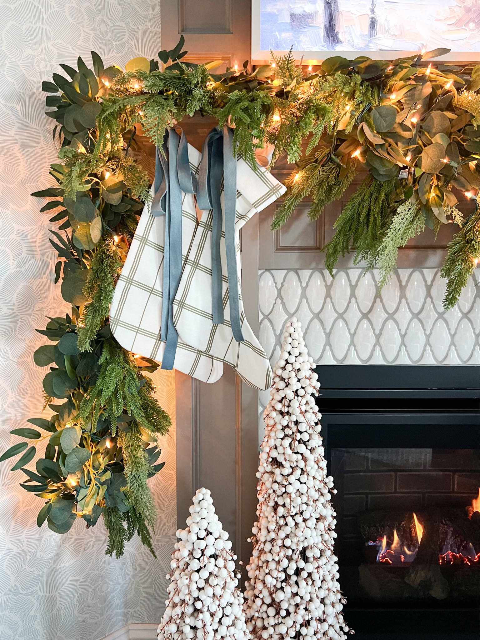 Close up view of the prettiest stockings from Brooke & Lou. I added a dusty blue ribbon from Amazon. Code BEYOND can be used for this stunning garland from The Accidental Farmgirl. I used two strands but did not layer them. I connected them to make the strand longer. Also, I cant believe these Berry trees are still in stock at Pottery Barn. They can be displayed all winter long! 

#LTKSaleAlert #LTKCyberWeek #LTKHome