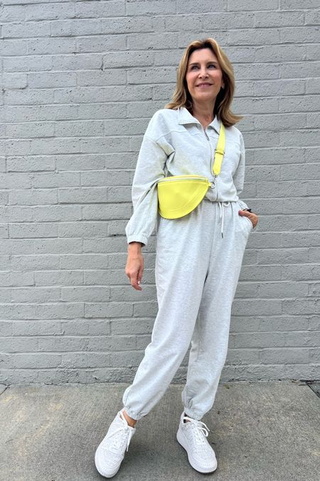 Heathered gray jumpsuit with a pop of color bag. 

#LTKover40 #LTKfindsunder50 #LTKstyletip