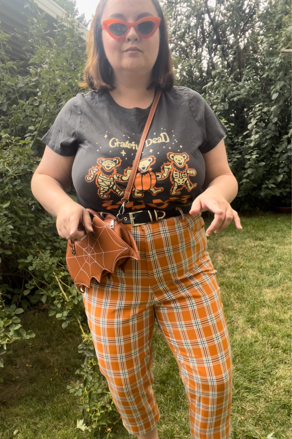 Todays Halloween outfit! 

Orange sunglasses, cat eye sunglasses, Halloween outfit, Halloween style, spooky season, pumpkin earrings, grateful dead tee, spider web purse, Amazon finds, Amazon gold, orange pants, black flip flops 

#LTKHalloween #LTKunder50