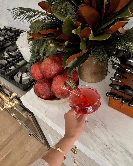 Kat Jamieson of With Love From Kat shares a holiday cocktail. Coupe glass, holiday decor, magnolia leaves, kitchen decor.

#LTKSeasonal #LTKHoliday #LTKhome