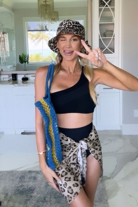 Heading to the beach! I paired my cheetah bucket hat with my cheetah swim skirt 🖤✨ 

swim l beach l swimming l swimsuit l beach cover l cover up l bucket hat 
