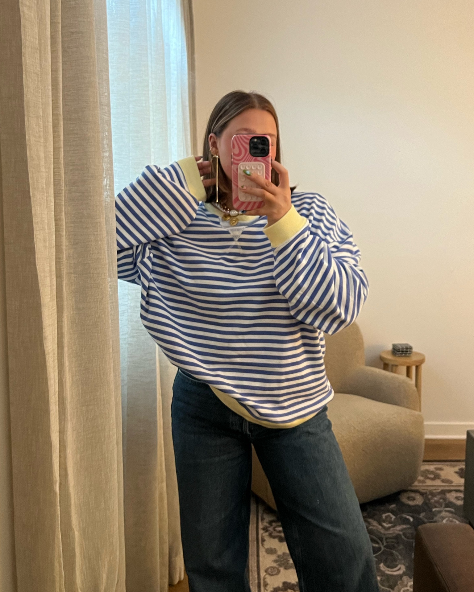 Size down in shirt it’s super soft and cute and oversized - this color isn’t online right now but other fun colors. Size small!! Jeans size down 1. Wearing 29 