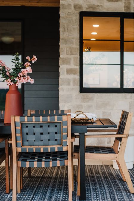Exterior texture is a thing, too!
Stone, siding, and wooden ceiling, a small patterned rug and woven chairs add so much depth here!

#exteriortexture #howdoicreatetexture #stoneexterior #blackhouse #blackexterior #plumblossoms 

#LTKSeasonal #LTKstyletip #LTKhome