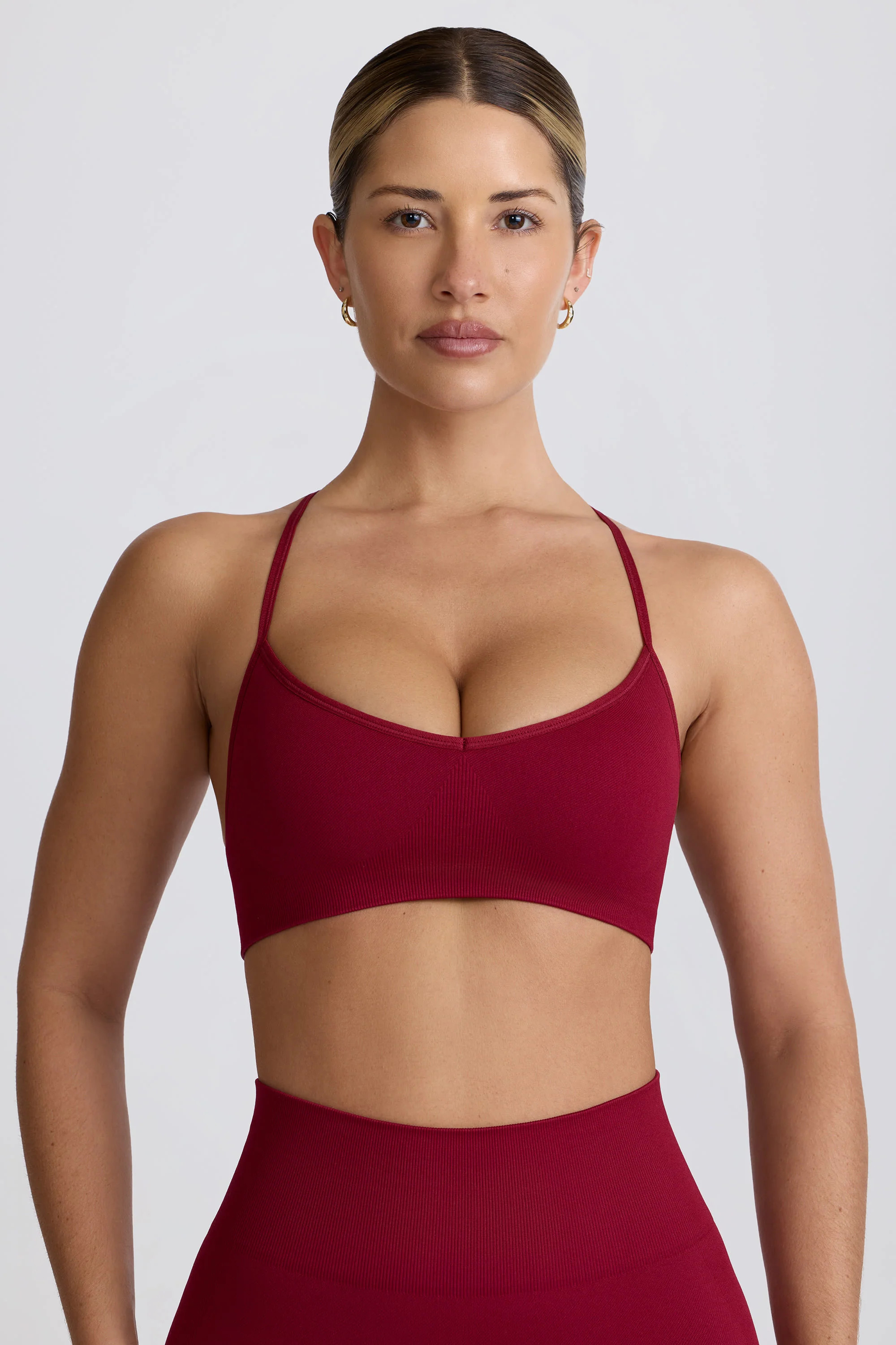 Super Sculpt Seamless Cross-Back Sports Bra in Burgundy | Bo+Tee