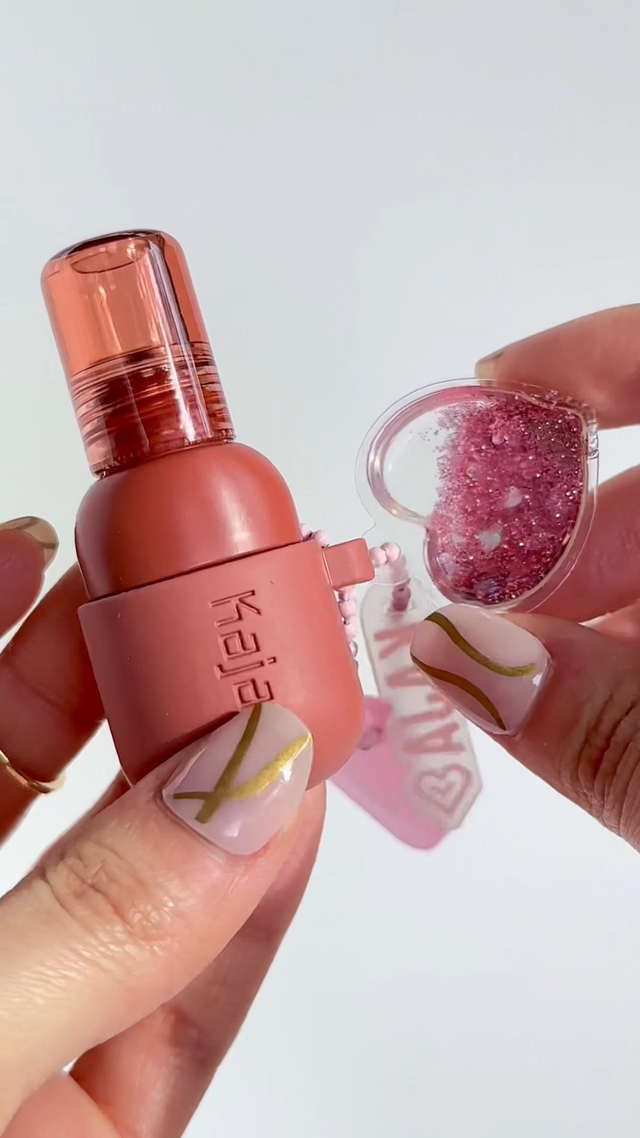 Peach fizz Jelly Charm 🍑🧡

Swatch of the @kajabeauty lip juicy jelly charms, they are so cute with the little charm included! I’ve been loving to reach for warm shades and peaches lately

The formula feels super smooth, hydrating and is very glossy ofc. Plus theres stain is very strong surprisingly, especially the longer its left on!

#LTKItBag #LTKBeauty #LTKFindsUnder50