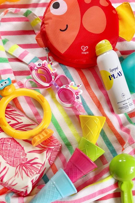 On our recent warm weather getaway I found a few new fun and very packable pool and beach toys to bring along with us. Here is what I packed: 
⠀⠀⠀⠀⠀⠀⠀⠀⠀
+ A travel @hapetoys_usa beach toy set that folds up compactly into a cute little fish shaped travel pouch. I tested out tons of the foldable silicone buckets but a lot of them felt junky and like they would break quickly. This one is made out of a nylon material which made it super lightweight to pack, had little pockets on the side for shells and the shovel, and the carrying case kept sand from getting all over our bags (If you're local, I bought the set at @Buttonwoodbooks!).
⠀⠀⠀⠀⠀⠀⠀⠀⠀
+ I used a canvas-coated @lillibridge_official make up bag to corral all of my pool stuff like swimming goggles, hotel keycards, our @supergoop sunscreens, and these really cute pool ring toys that look like scuba diving ducks.
⠀⠀⠀⠀⠀⠀⠀⠀⠀
+ Another fun beach toy I picked up was a set of ice cream cones with an ice cream cone scooper shovel for making ice cream cones in the sand on the beach. I think these are going to be a hit this summer with Jane and her friends. 
⠀⠀⠀⠀⠀⠀⠀⠀⠀
+ I always pack a super lightweight tote bag for an easy way to cart all of our gear, books, sunscreen and toys down to the pool and beach when we travel - this striped one is my favorite because it rolls up into a tiny little ball in my suitcase (and Target has made a nearly identical version this season that I tagged, along with everything else in the video, on my @shop.ltk page!) 
⠀⠀⠀⠀⠀⠀⠀⠀⠀
#Domestikatetravels 

#LTKSeasonal #LTKKids #LTKTravel