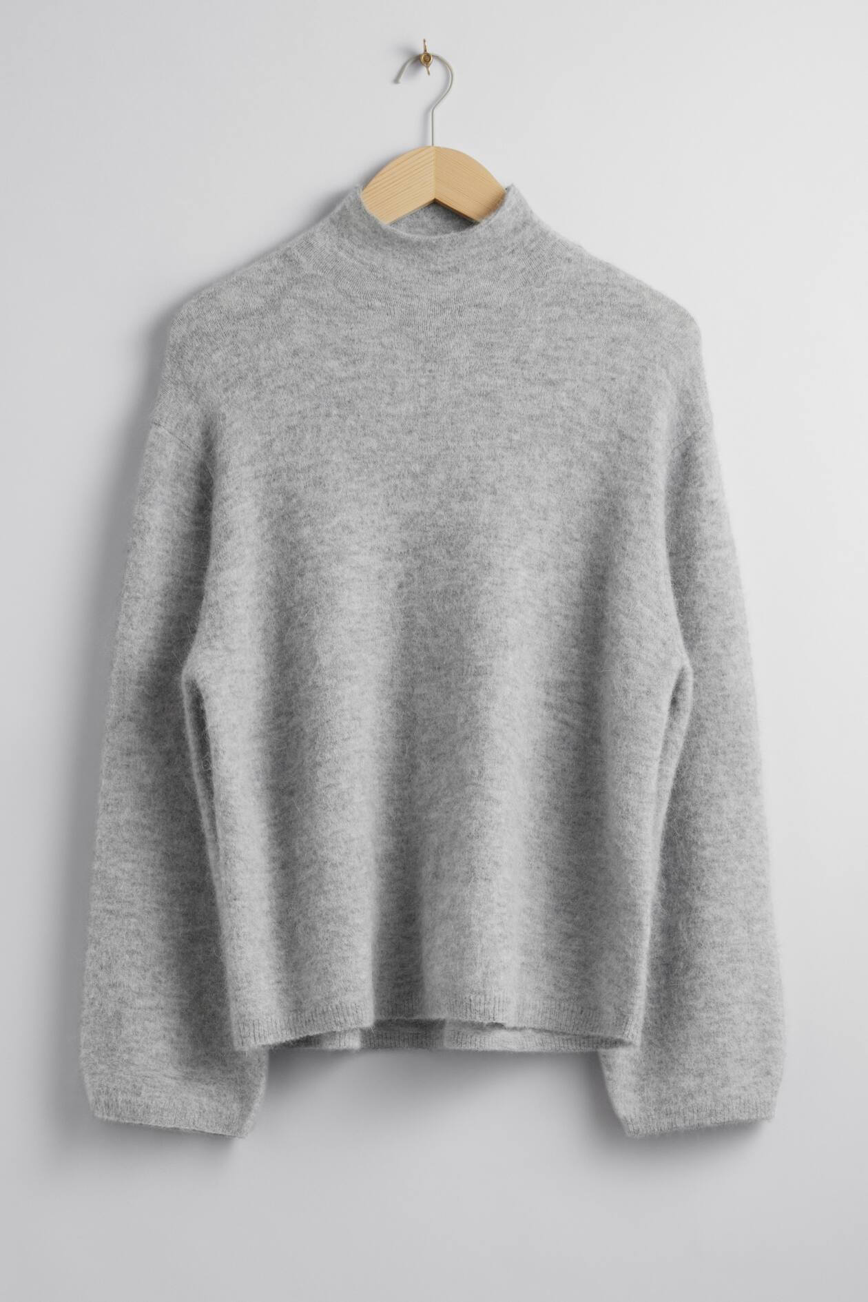Gebreide trui met opstaande boord | H&M (DE, AT, CH, NL, FI)