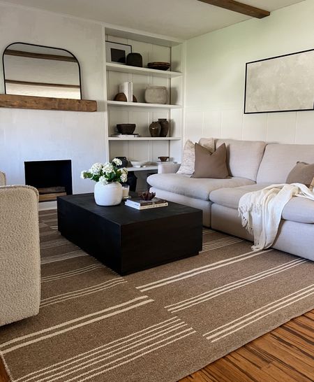 living room spring refresh 

love my taupe wool stripe rug! this is so soft and perfect neutral with a little more pattern and trend forward. extra 20% off sitewide code: USA for all my fav rugs! lighter throws for spring + the prettiest faux hydrangeas that last 

#LTKsalealert #LTKstyletip #LTKhome