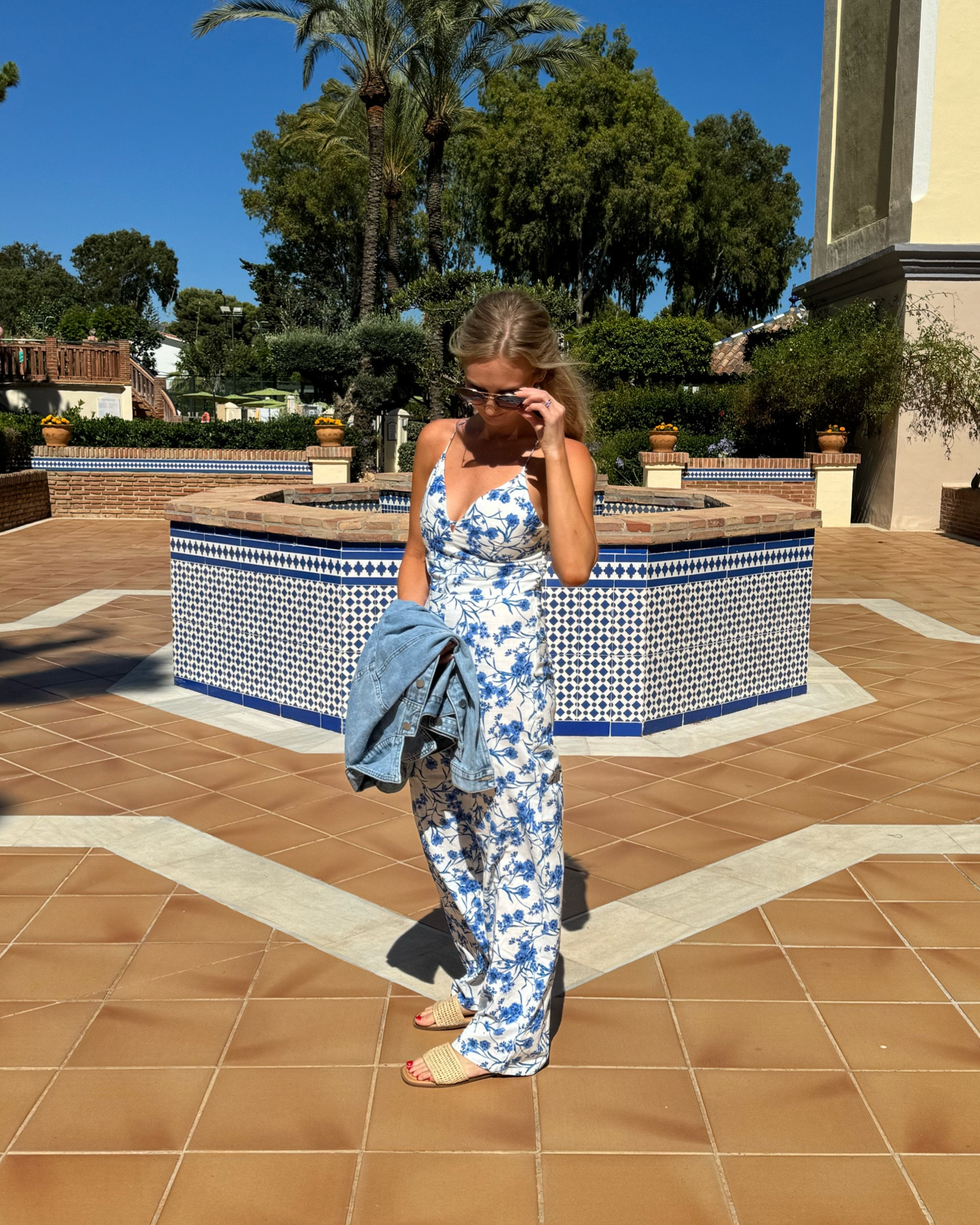 Bought this jumpsuit in Madrid - such a great classic. 

Oversized jean jacket, sandals, summer outfit 

#LTKShoeCrush #LTKFindsUnder100