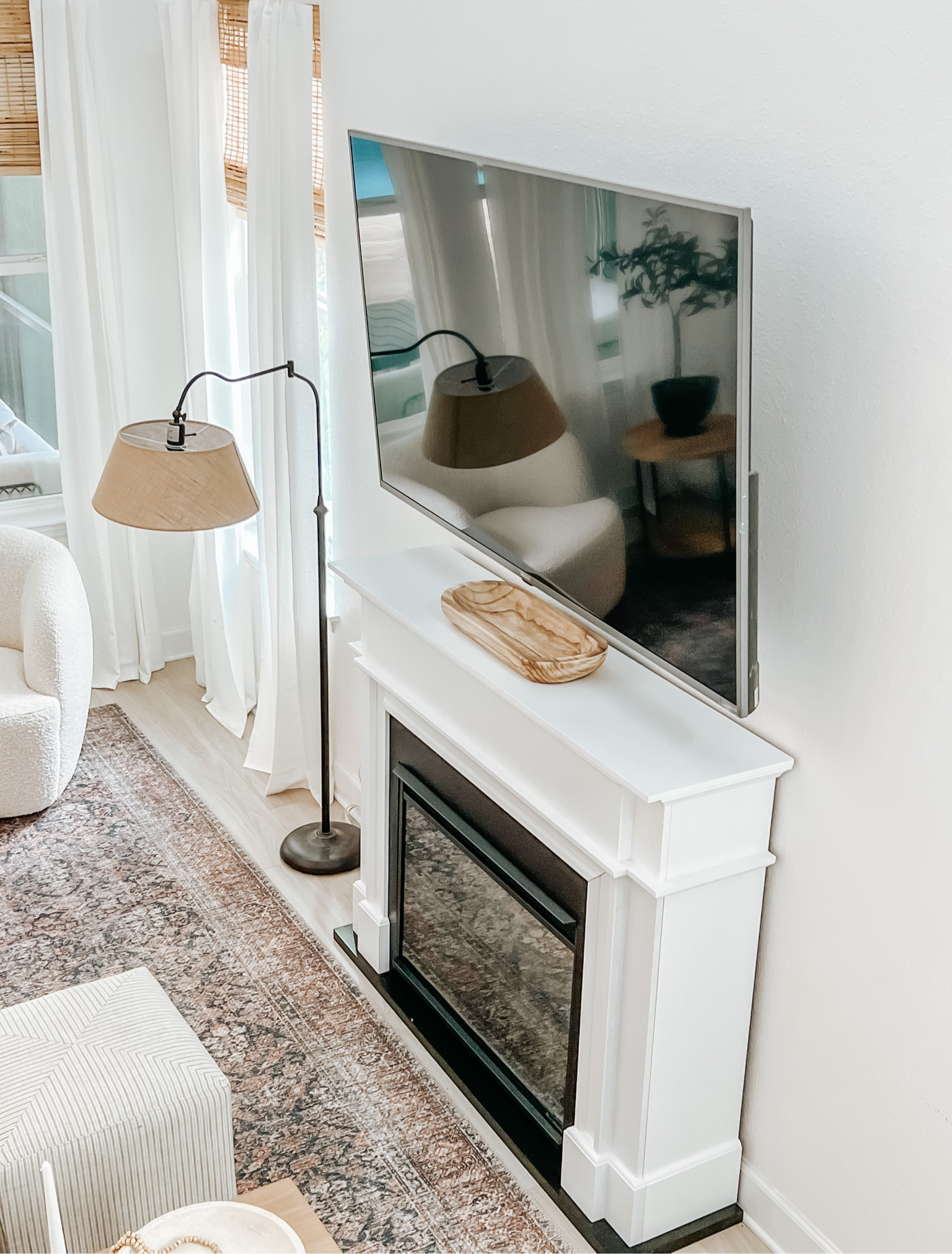 Fireplace. Floor lamp. Area rug. Boucle chair  

#LTKhome #LTKSeasonal