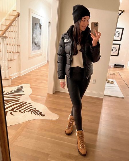 Kat Jamieson of With Love From Kat wears a winter outfit. Cashmere beanie, black puffer jacket, half zip sweater, faux leather leggings, brown suede booties, neutral style, classic style. 

#LTKshoecrush #LTKSeasonal #LTKstyletip