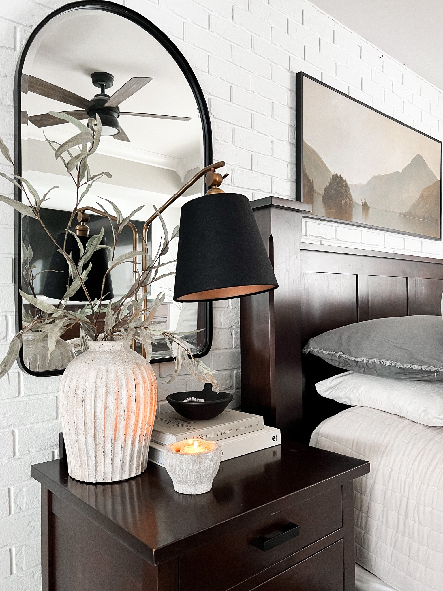Nightstand styling, bedroom decor, arched wall mirror, amazon home, ceiling fan, pottery barn vase, vintage print, eucalyptus stems, coffee table books, design books, decorative books, target quilt, 

#LTKFind #LTKhome #LTKstyletip
