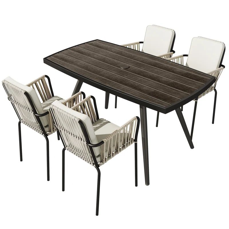 Caihla Rectangular 4 - Person Outdoor Dining Set with Cushions | Wayfair North America