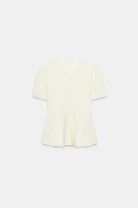 Model height: 178 cmTop made from a cotton blend. Featuring a V-neck, short puff sleeves and a st... | Zara UK