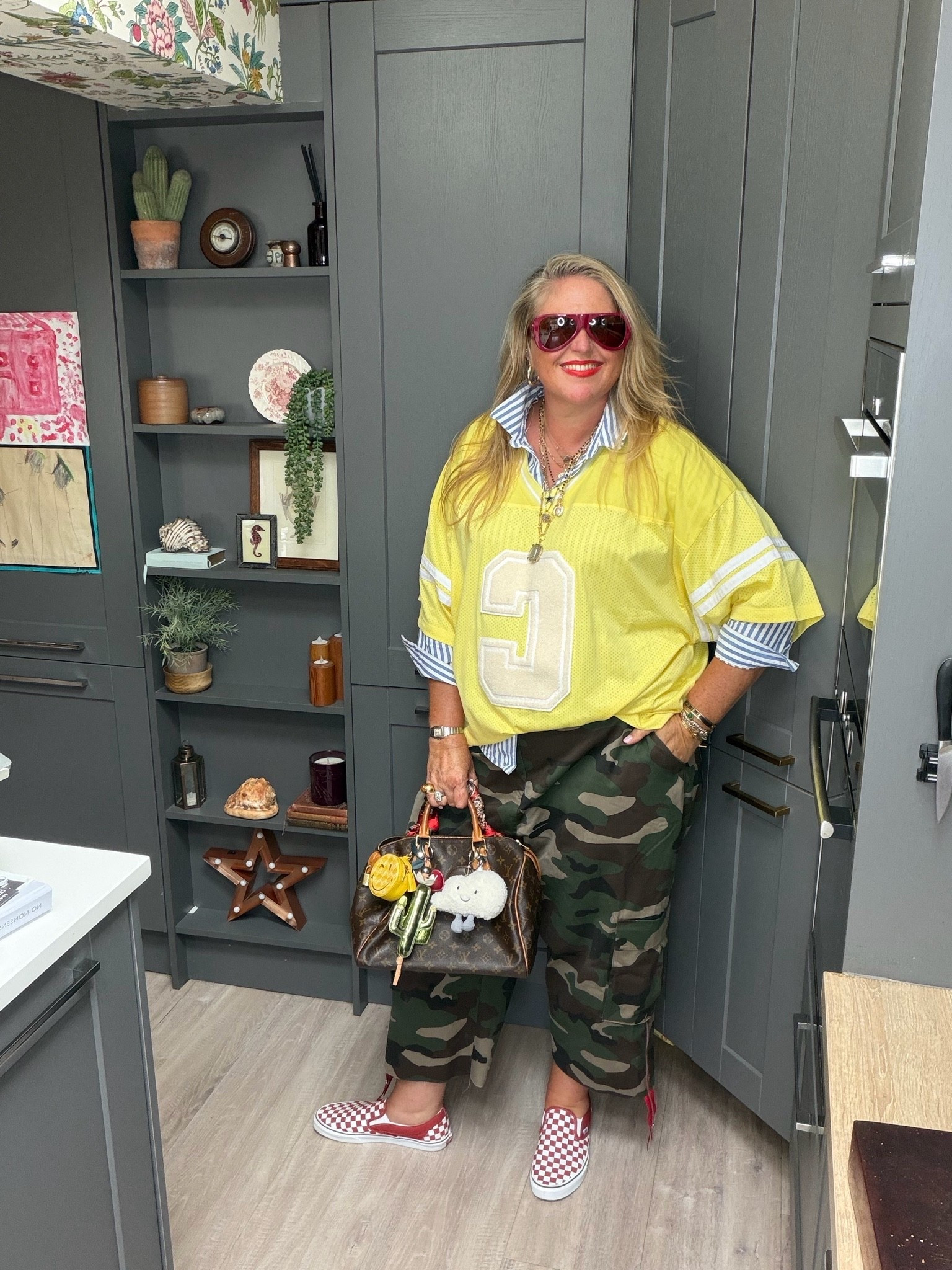 Checkerboard vans, red sunglasses, camo trousers, striped shirt, brown tote bag, yellow football shirt

#LTKautumn #LTKplussize #LTKstyletip