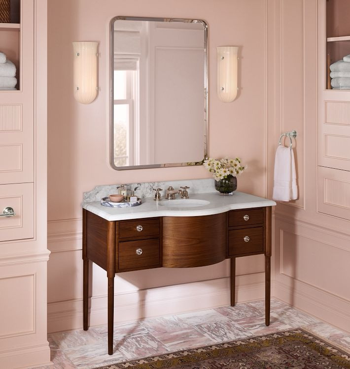 Elevate your bath for the coming holiday season with  this new elegant walnut bath vanity console from Rejuvenation. Love the classic silhouette, marble top and scalloped backsplash. The solid wood construction and soft closing drawers will definitely make the piece durable and pleasant to use, #bathvanity 

#LTKHoliday #LTKCyberWeek #LTKHome